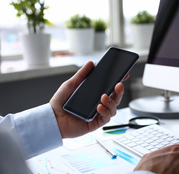 Businessman hipster holds telephone background