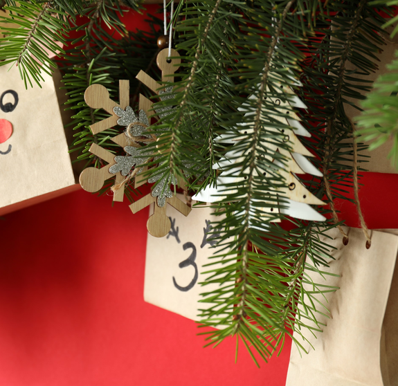 Christmas Advent calendar with spruce on red background