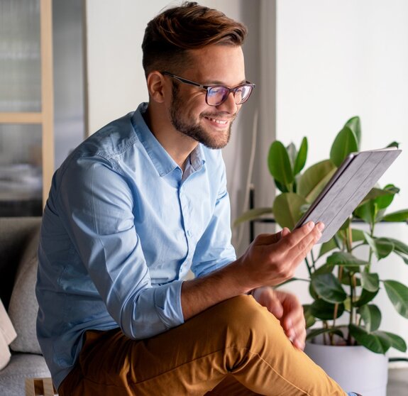 Young Man holding digital tablet