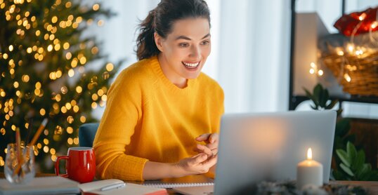 Woman working in home office before Christmas