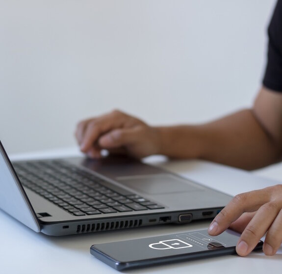 Cyber security concept. Business people type passwords and press the check button on a mobile smartphone application connect to the database via a data security system technology on display at office