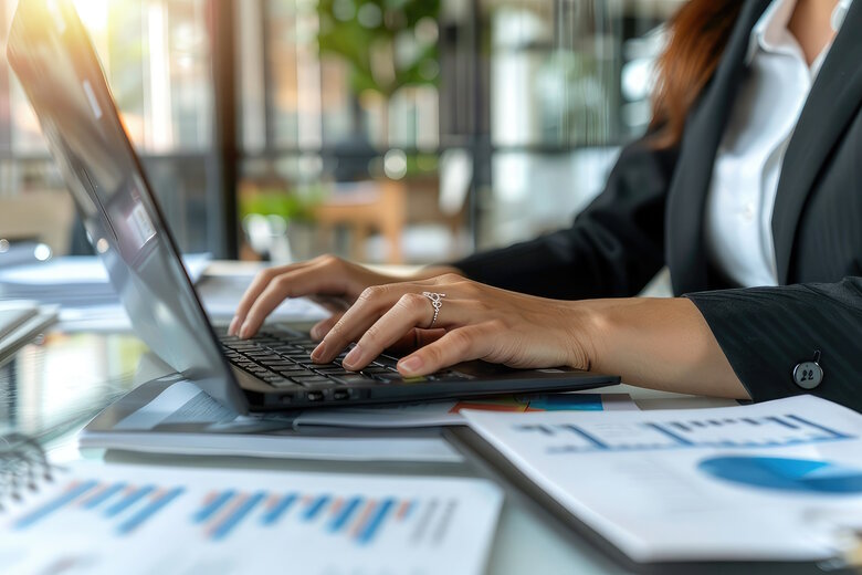 business woman close up of a person typing on a laptop computer