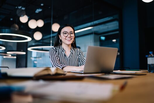 Happy woman working with laptop