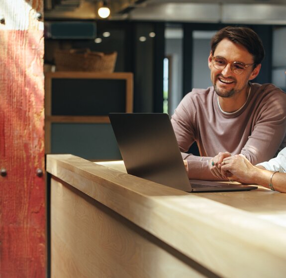 Business professionals joining an online conference in a coworking office