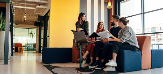 Multicultural businesspeople working in an office lobby