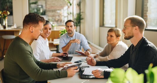 Businessman sharing new business plan with team