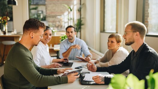 Businessman sharing new business plan with team