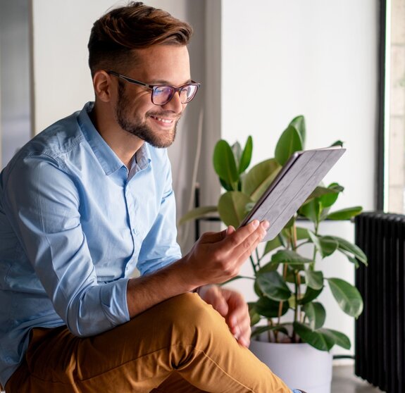 Young Man holding digital tablet