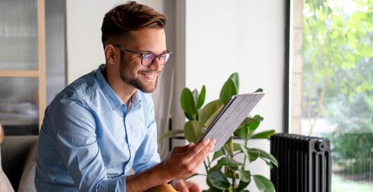 Young Man holding digital tablet